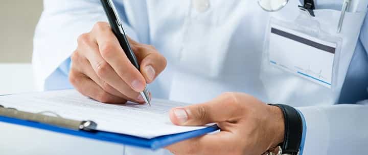 doctor with medical forms