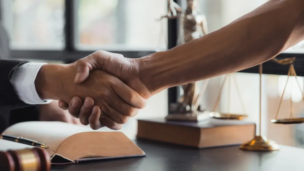 Texas Jury Awards $18.6 concept with lawyer and client handshake