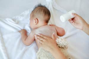 baby being powdered