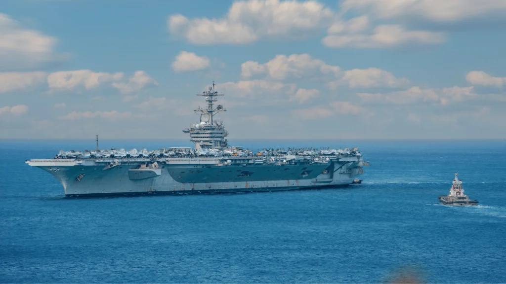 Navy ship with crew members working aboard
